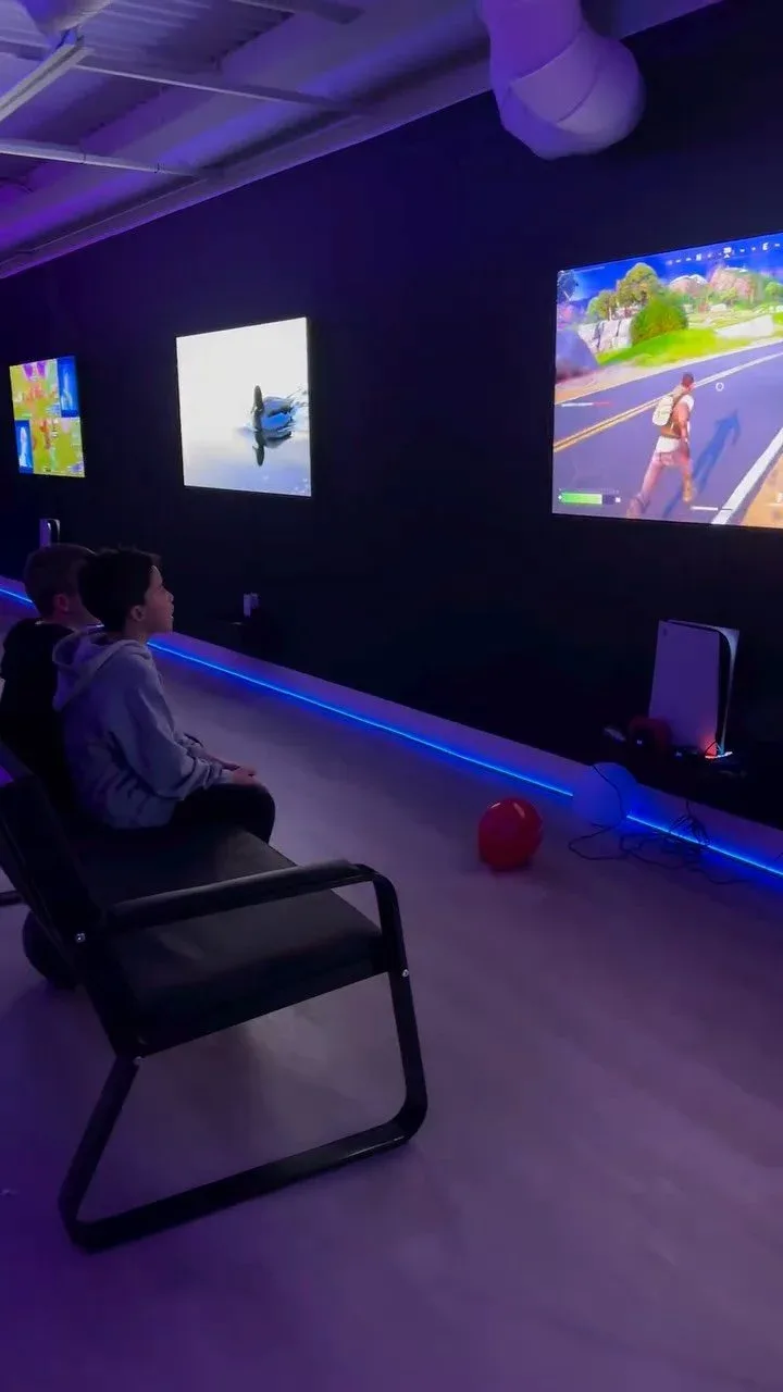 Seating and screens in the First Last Sim Lounge gaming area