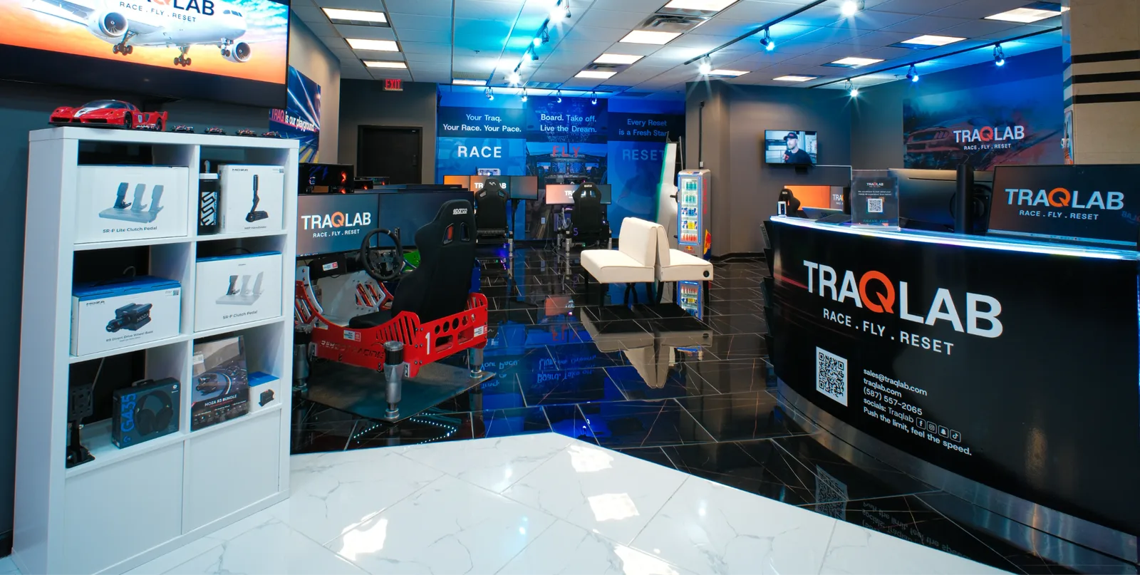 TraqLab reception counter and simulator area.