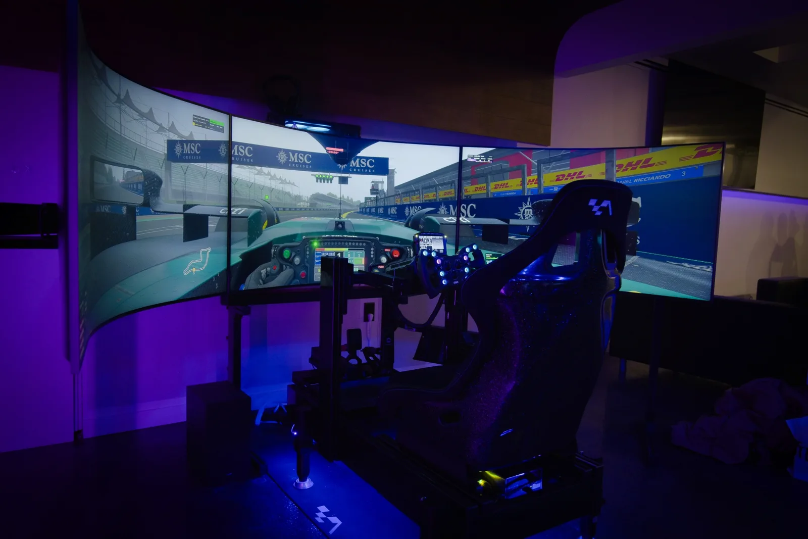 Triple-screen racing simulator cockpit at HorizonGT