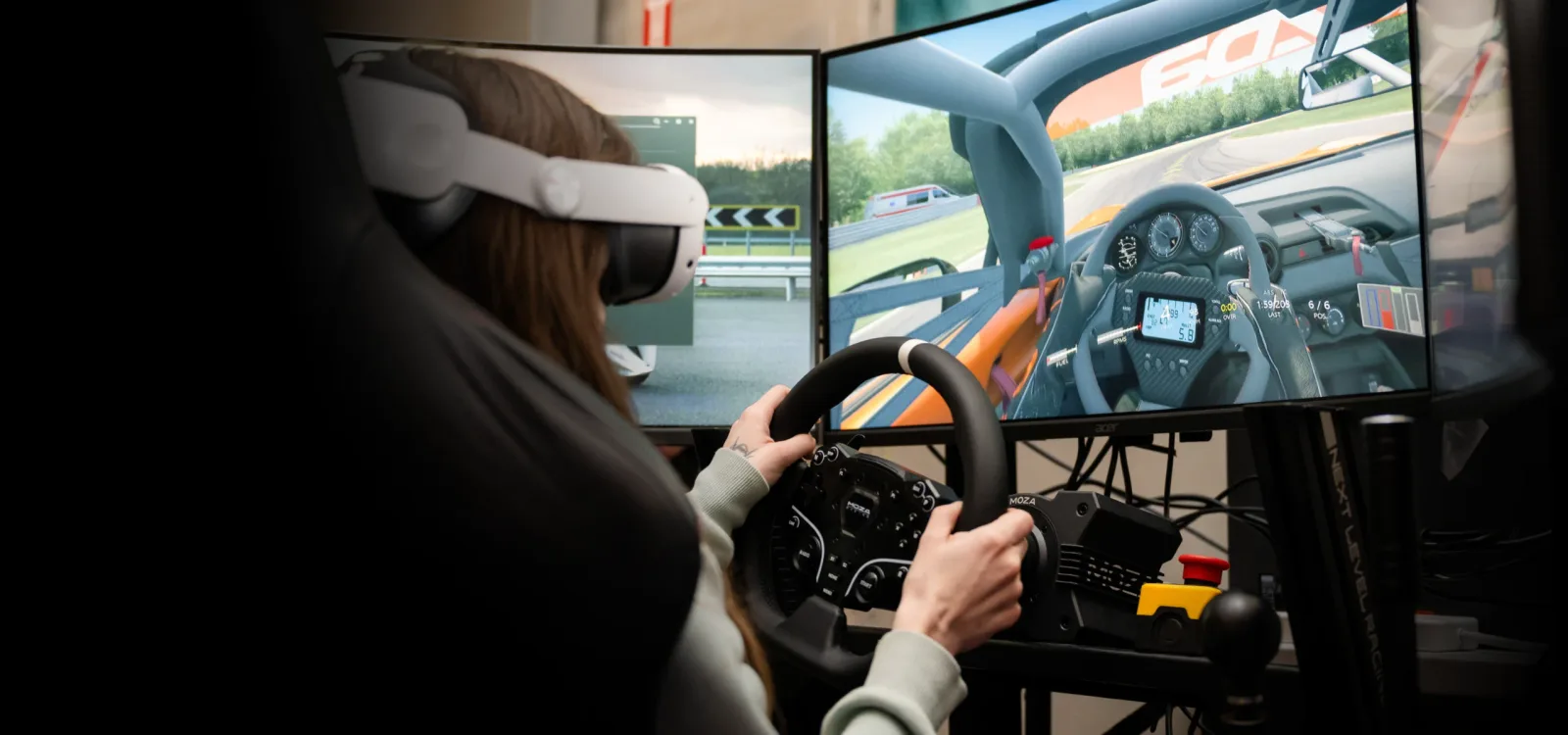 Driver wearing a VR headset while using a DriVR racing simulator.