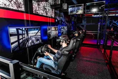Players using the racing simulator row at Zone15